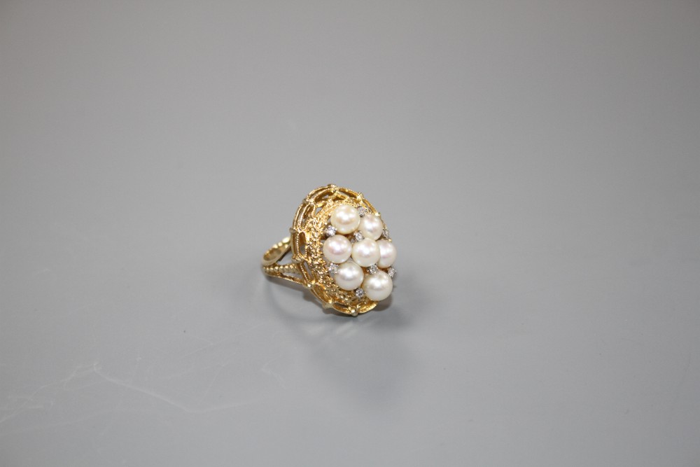 A modern 14k yellow metal, cultured pear and diamond cluster set oval dress ring, size P, gross weight 9.2 grams.